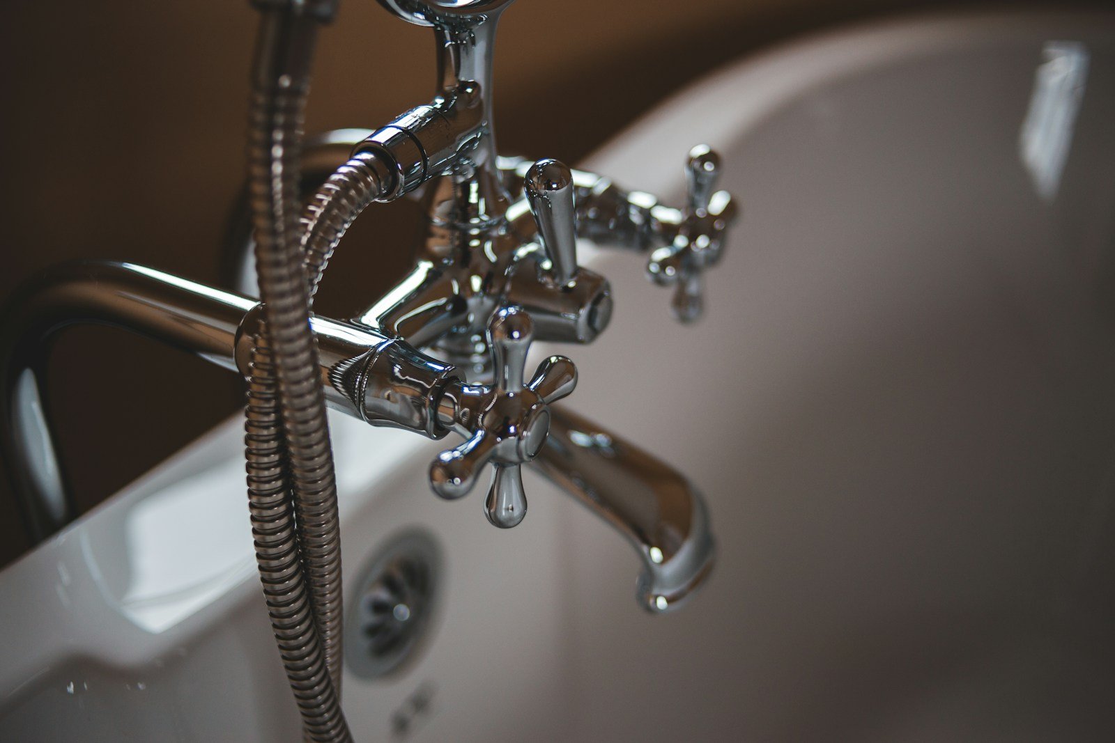 Plumber working on pipe repair in San Jose home